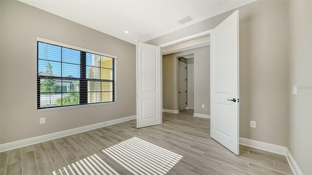 unfurnished bedroom featuring light hardwood / wood-style flooring