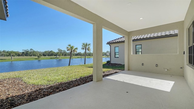 view of patio featuring a water view