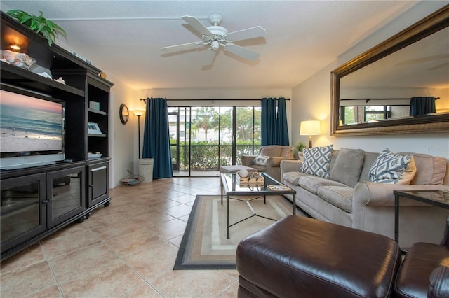 living room featuring light tile patterned floors and ceiling fan