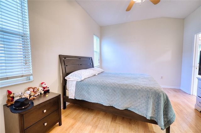 bedroom with light hardwood / wood-style floors and ceiling fan