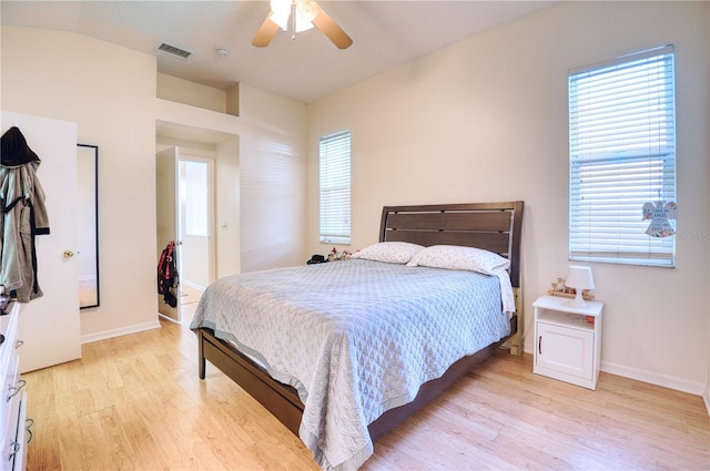 bedroom featuring light wood-type flooring and ceiling fan