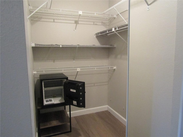 walk in closet featuring hardwood / wood-style floors