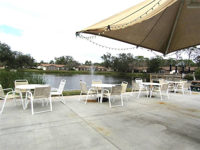 view of patio featuring a water view