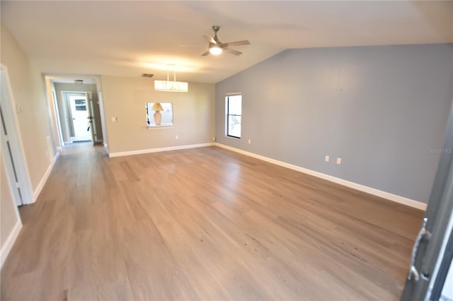 unfurnished room featuring vaulted ceiling, ceiling fan, and light hardwood / wood-style floors