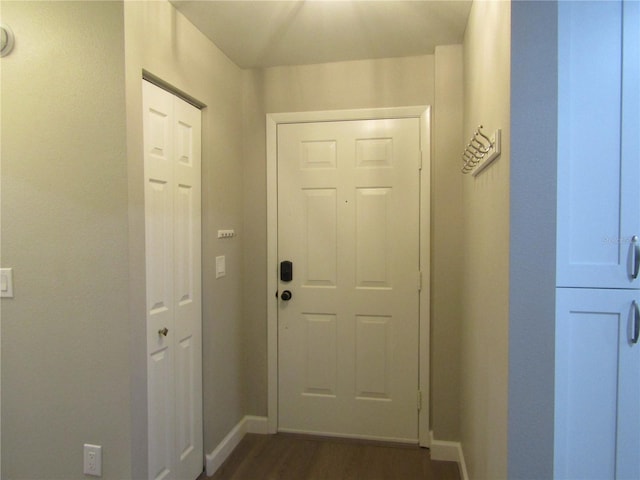 doorway to outside with dark hardwood / wood-style floors