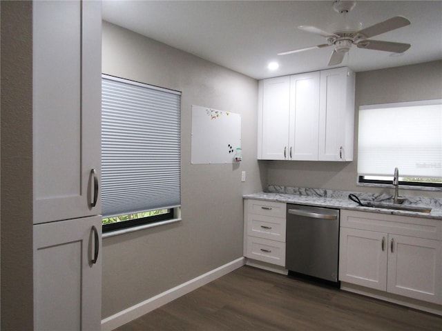 kitchen with white cabinetry, sink, stainless steel dishwasher, and light stone counters