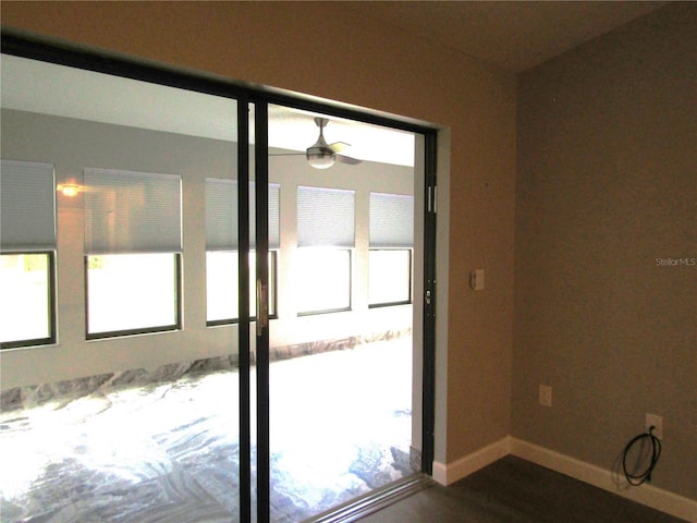 entryway featuring hardwood / wood-style flooring and ceiling fan