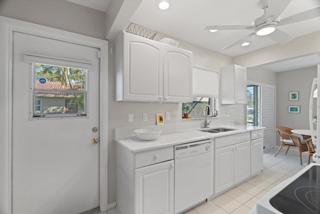 kitchen featuring white cabinetry, dishwasher, sink, light tile patterned floors, and ceiling fan