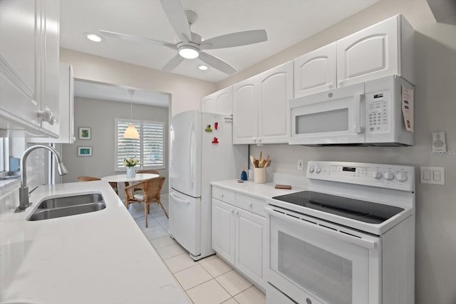 kitchen with white cabinetry, white appliances, ceiling fan, and sink