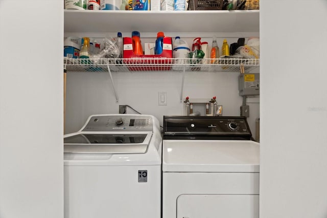 clothes washing area featuring washing machine and clothes dryer