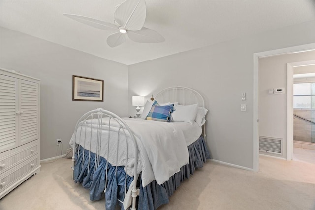 bedroom featuring ceiling fan and light carpet