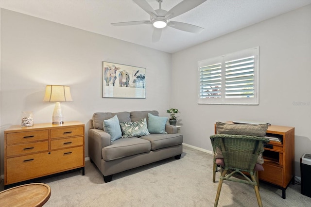 office space featuring ceiling fan and light colored carpet