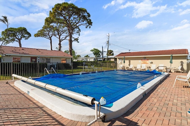 view of swimming pool featuring a patio area