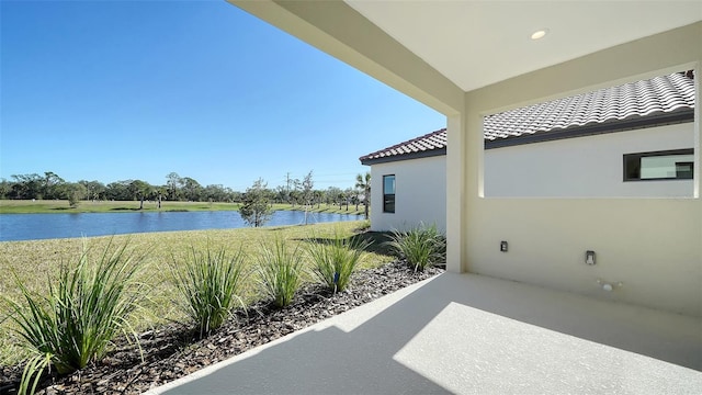 view of patio featuring a water view