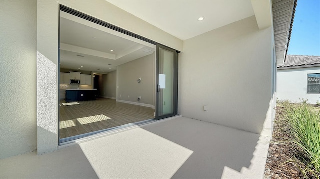 view of patio featuring a balcony