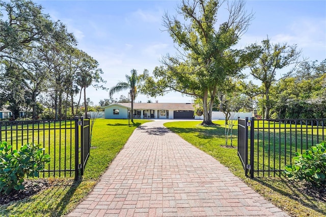 exterior space with a garage and a front yard