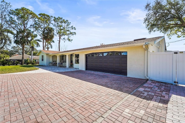 ranch-style house featuring a garage