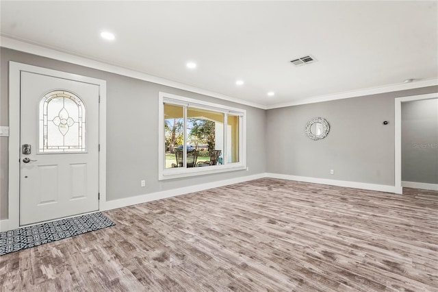 entryway featuring crown molding and wood-type flooring