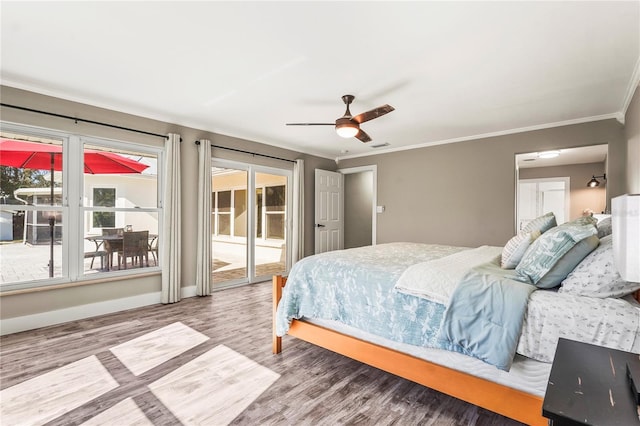 bedroom featuring hardwood / wood-style flooring, ornamental molding, access to outside, and ceiling fan