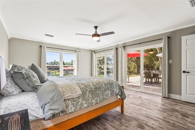 bedroom featuring wood-type flooring, ornamental molding, access to outside, and ceiling fan