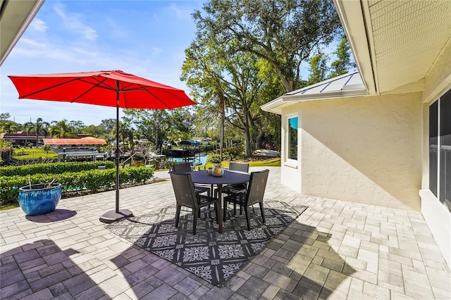 view of patio featuring a water view