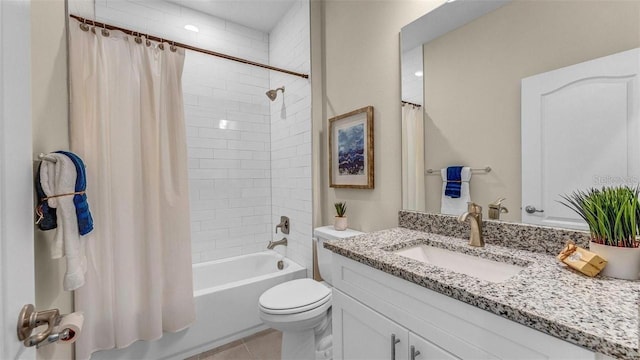 full bathroom featuring tile patterned flooring, vanity, toilet, and shower / bath combo with shower curtain