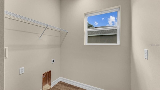 laundry area with hardwood / wood-style floors and electric dryer hookup