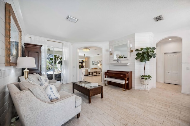 living room with light hardwood / wood-style flooring