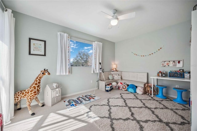 rec room featuring ceiling fan and carpet floors