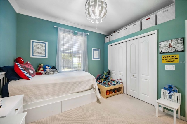 bedroom with light colored carpet and a closet