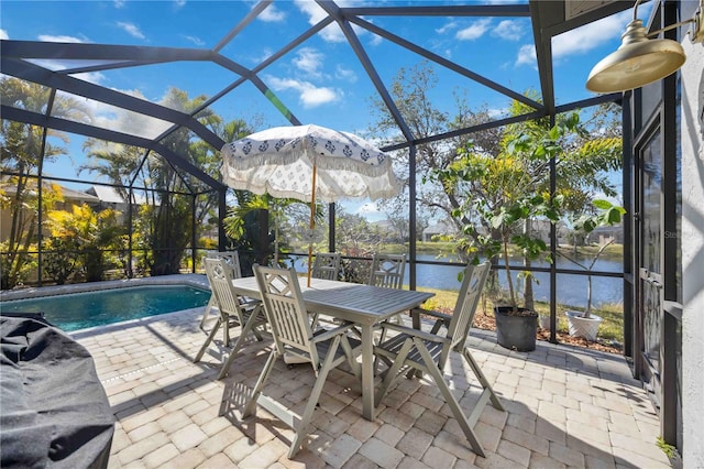 view of patio / terrace featuring a water view and a lanai