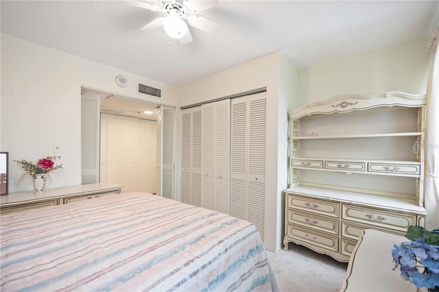 bedroom with light colored carpet and ceiling fan