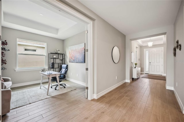 home office featuring a tray ceiling