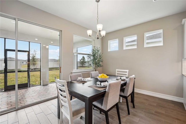 dining room with a notable chandelier and a wealth of natural light