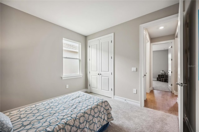 carpeted bedroom with a closet