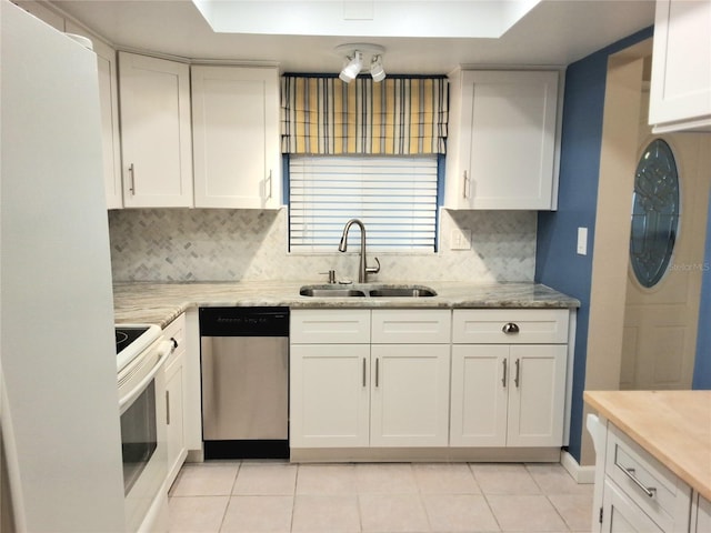 kitchen with dishwasher, light tile patterned floors, sink, white cabinets, and electric stove