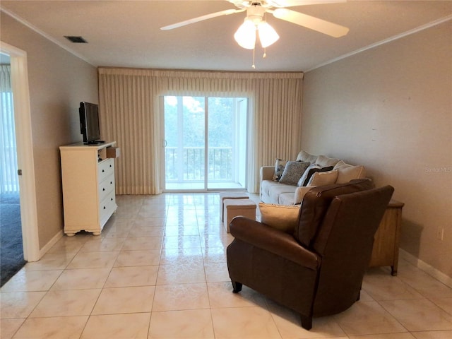 tiled living room featuring ceiling fan and ornamental molding