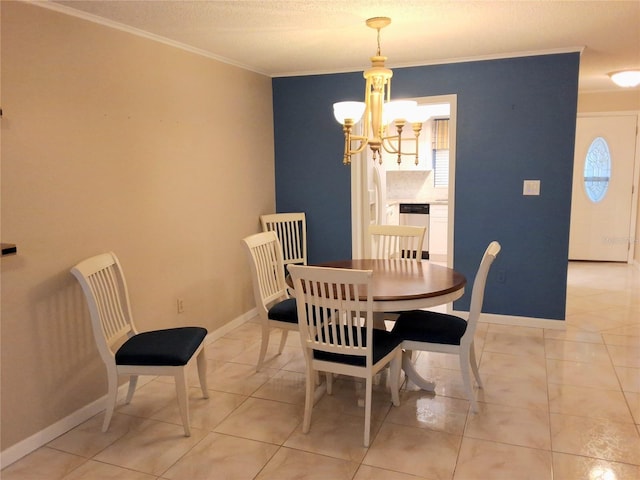 tiled dining room featuring a textured ceiling, ornamental molding, and a chandelier