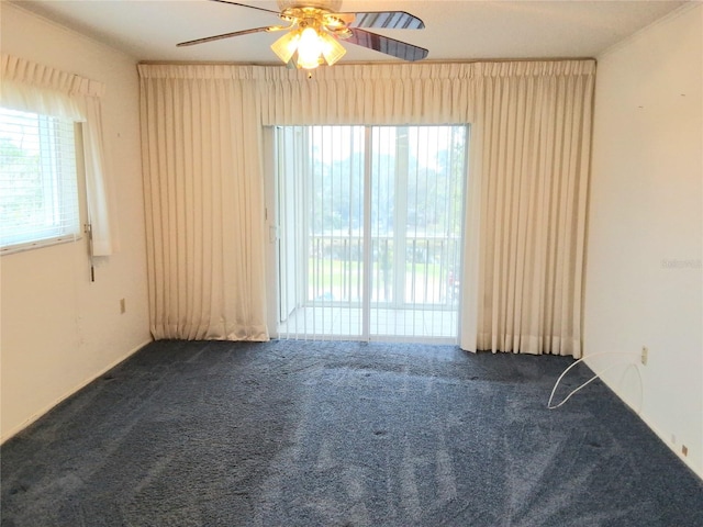 carpeted empty room with ceiling fan