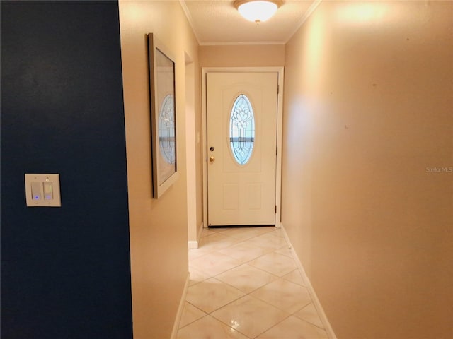 doorway to outside with ornamental molding and light tile patterned floors