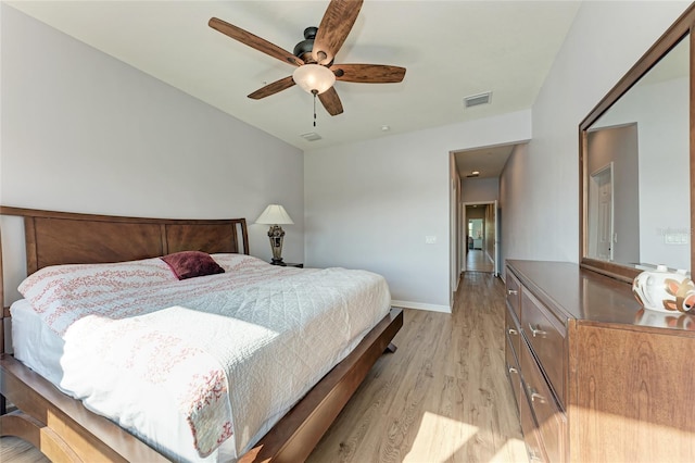 bedroom with ceiling fan and light hardwood / wood-style floors