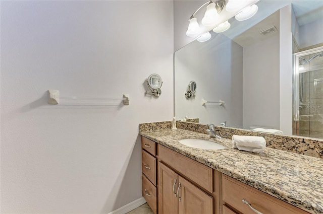 bathroom with vanity and an enclosed shower