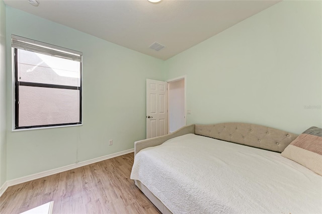 bedroom with light hardwood / wood-style floors