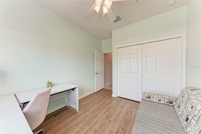 office with ceiling fan and light hardwood / wood-style floors