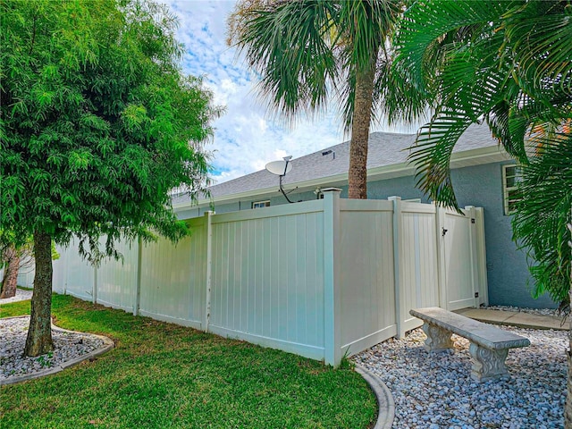 view of property exterior with a lawn