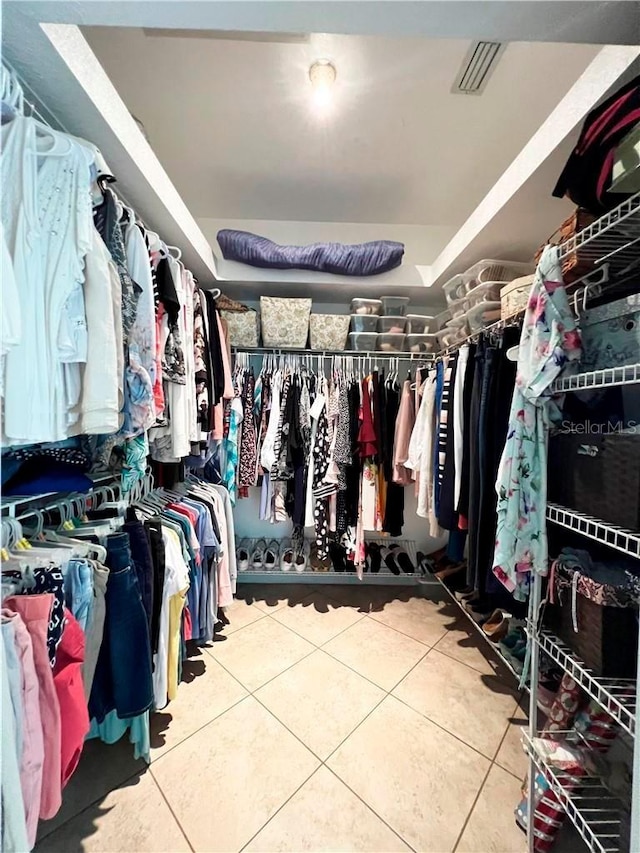 spacious closet with tile patterned flooring