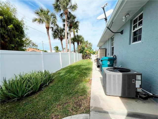 view of yard featuring central air condition unit