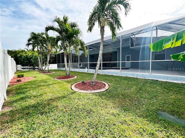 view of yard with a lanai