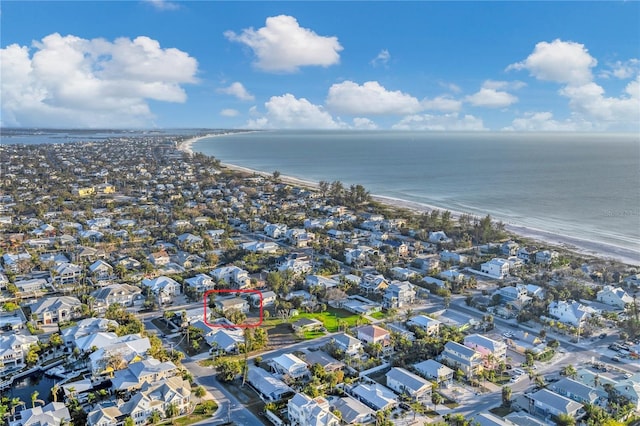 bird's eye view with a water view and a view of the beach