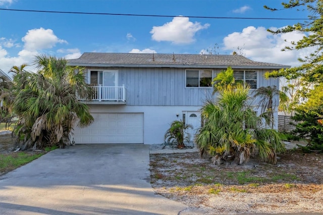 view of front of home with a balcony and a garage